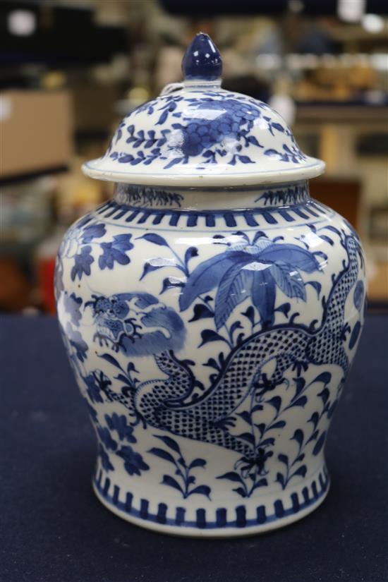 A 19th century Chinese blue and white vase and cover, decorated with dragons height 20cm